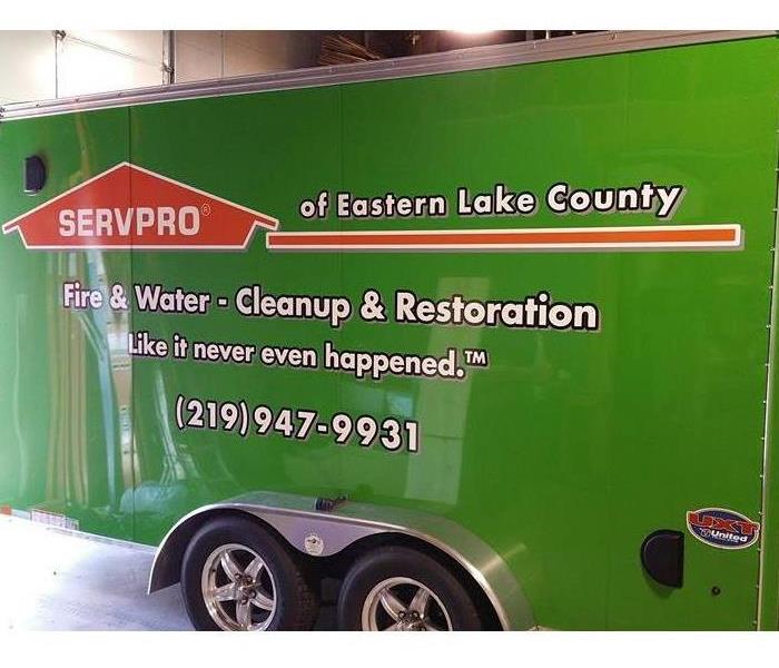 green SERVPRO of Eastern Lake County trailer with our phone number and information on the side